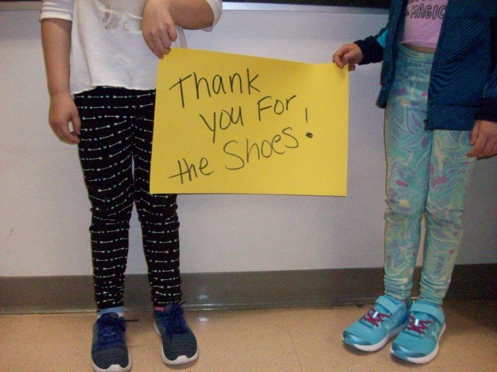 Hansen Shoe Fund student with shoes